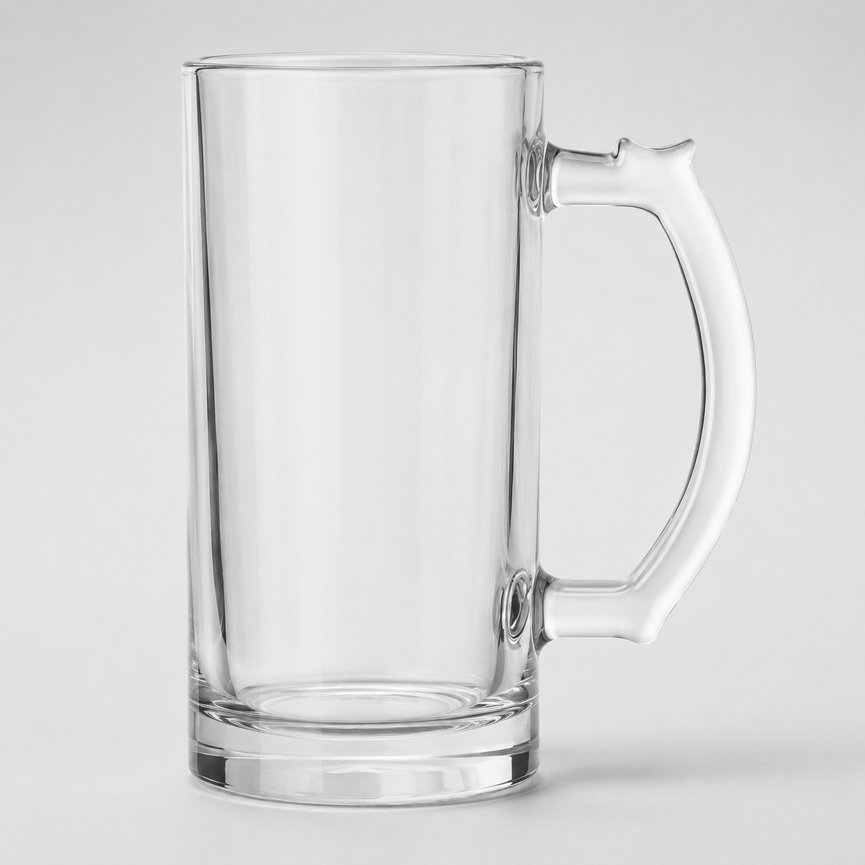 Neapdrukāta 470 ml caurspīdīga stikla alus glāze sublimācijai uz pelēka studijas fona
