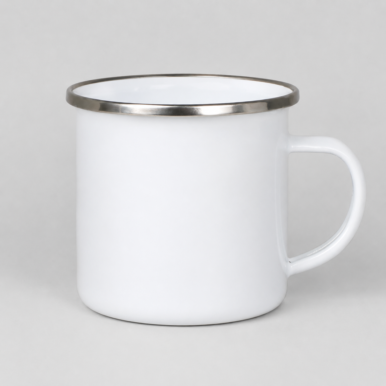 White mug with a silver rim on a light gray background