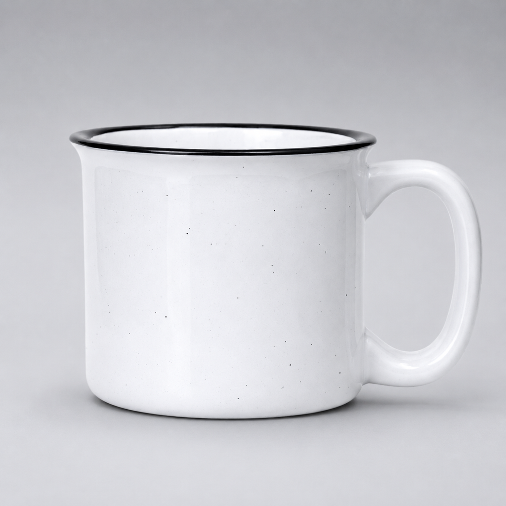 A white ceramic mug with a black rim and a small speckled texture, shown against a neutral gray background.